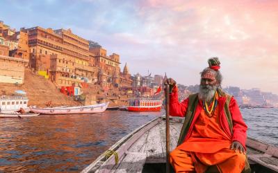 Indian Sadhu  boat ride on river Ganges  Varanasi