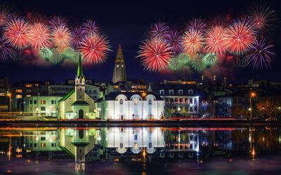 Reykjavik (Iceland) with fireworks during New Year's celebration